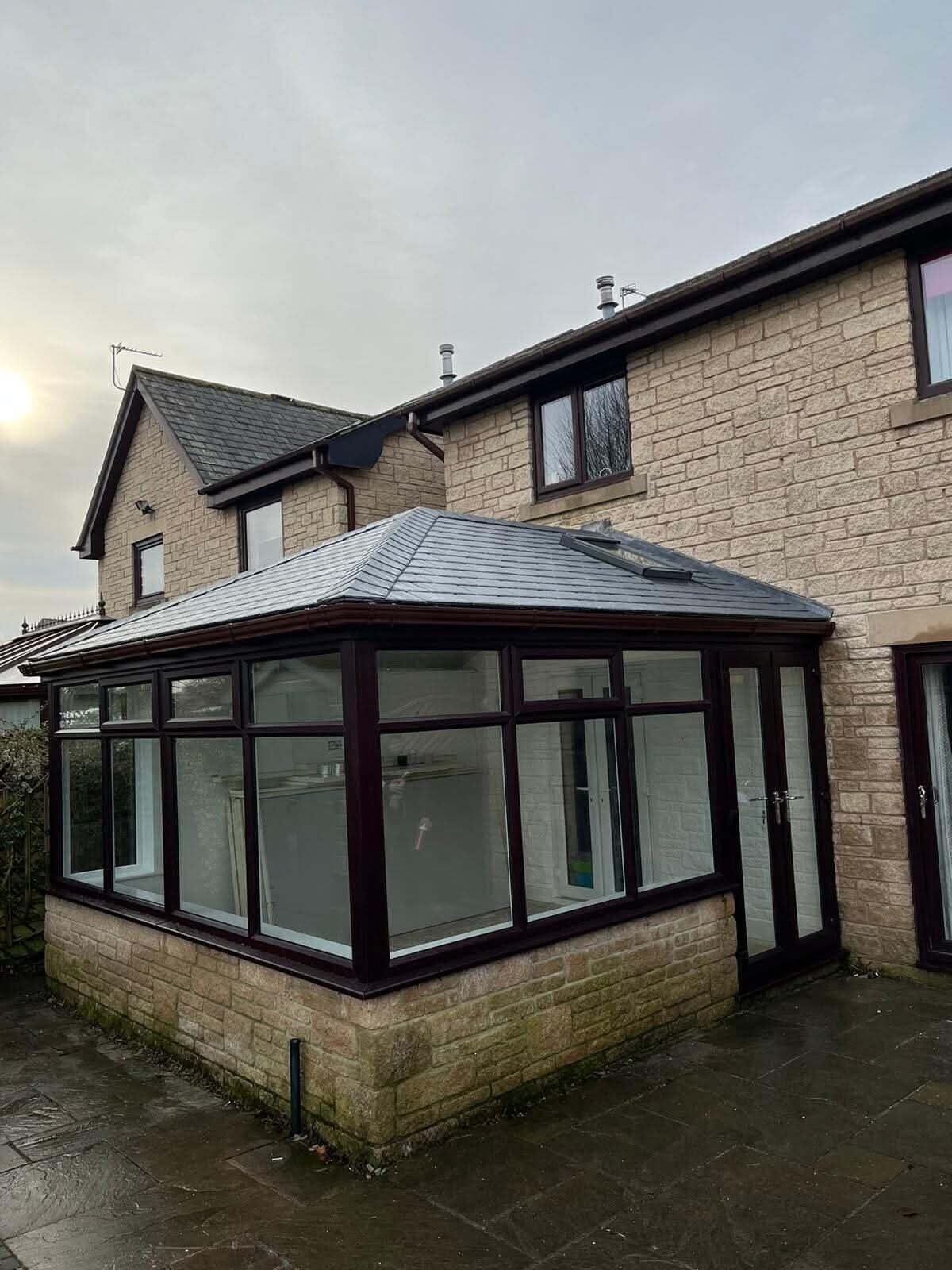 Conservatory with a solid tiled roof