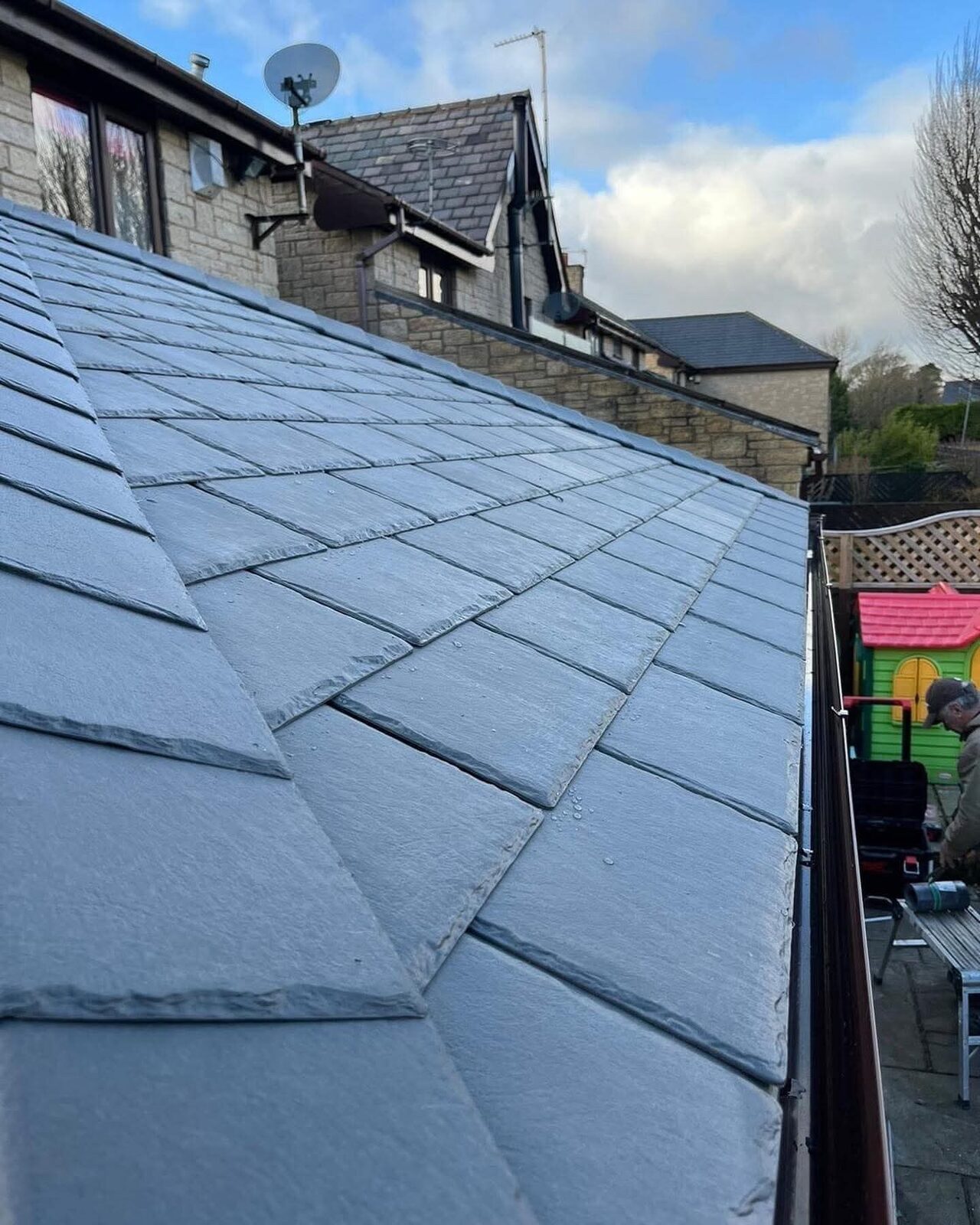 Grey slate hipped roof, newly finished