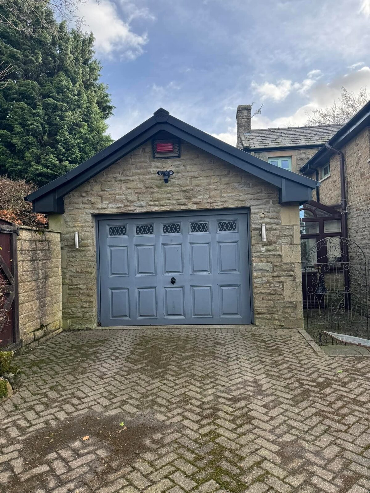 Grey up-and-over garage door