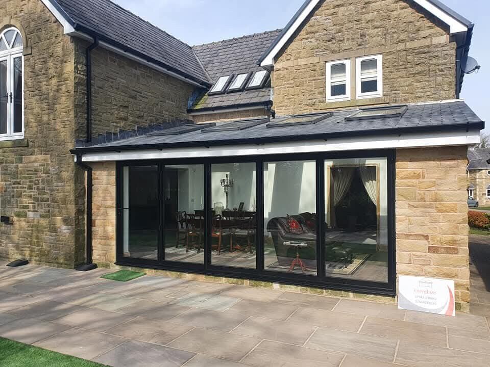 Stone house with a bi-fold door extension