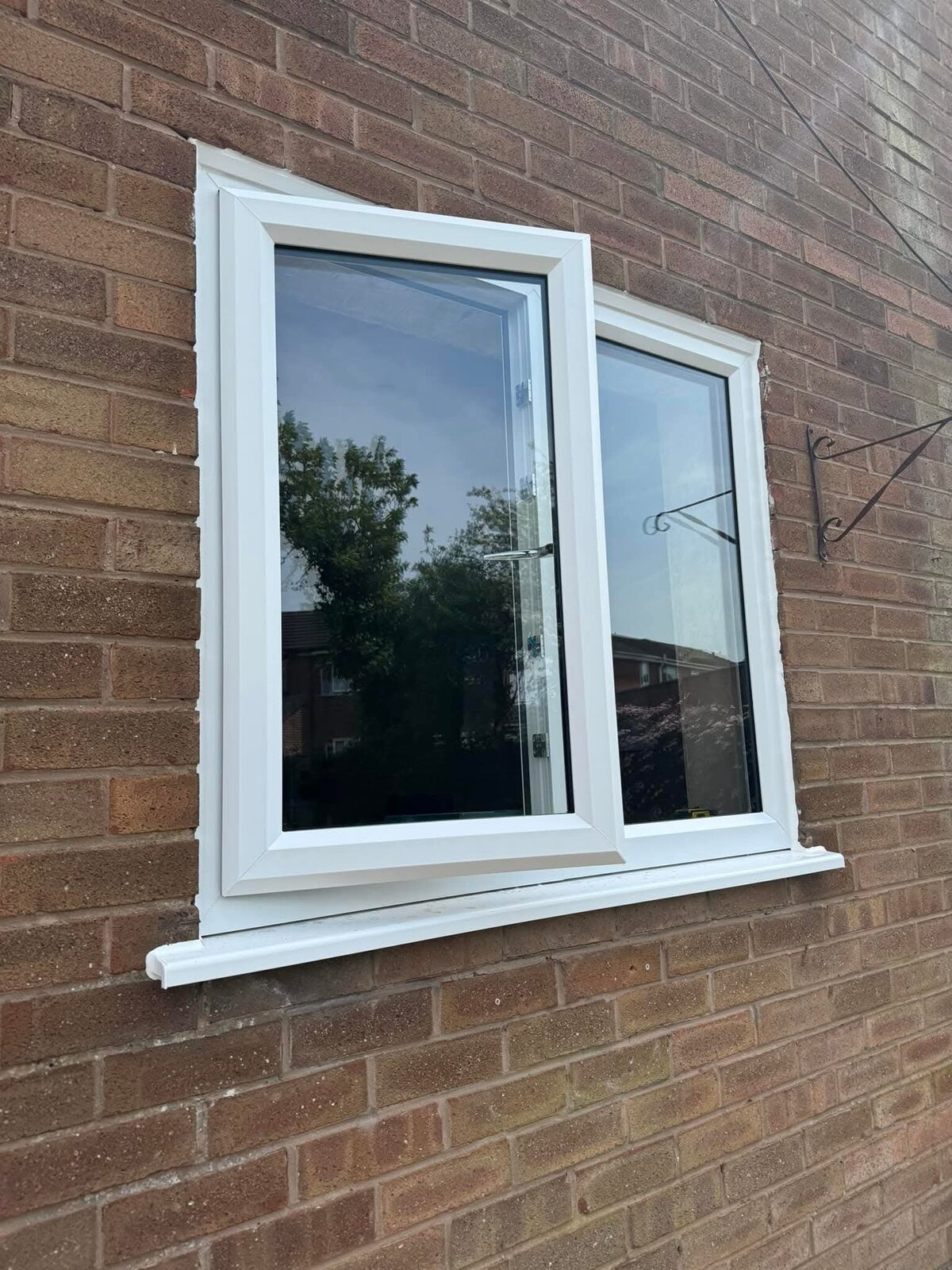 White casement window, open